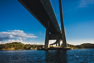 Photo of a completed government bridge project in West Bengal under clear blue skies.