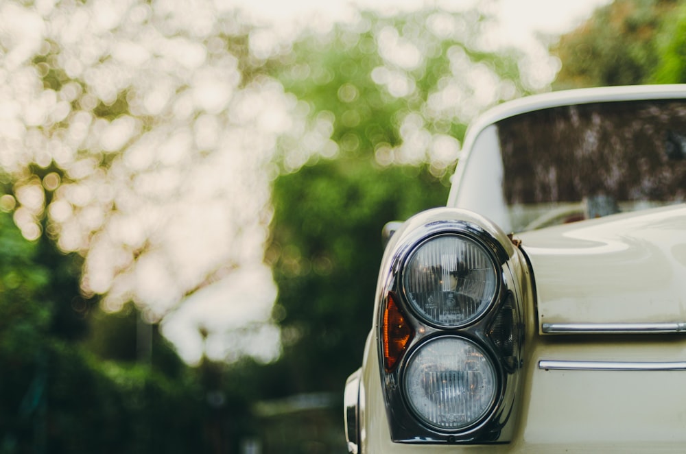 selective focus photography of vehicle headlight