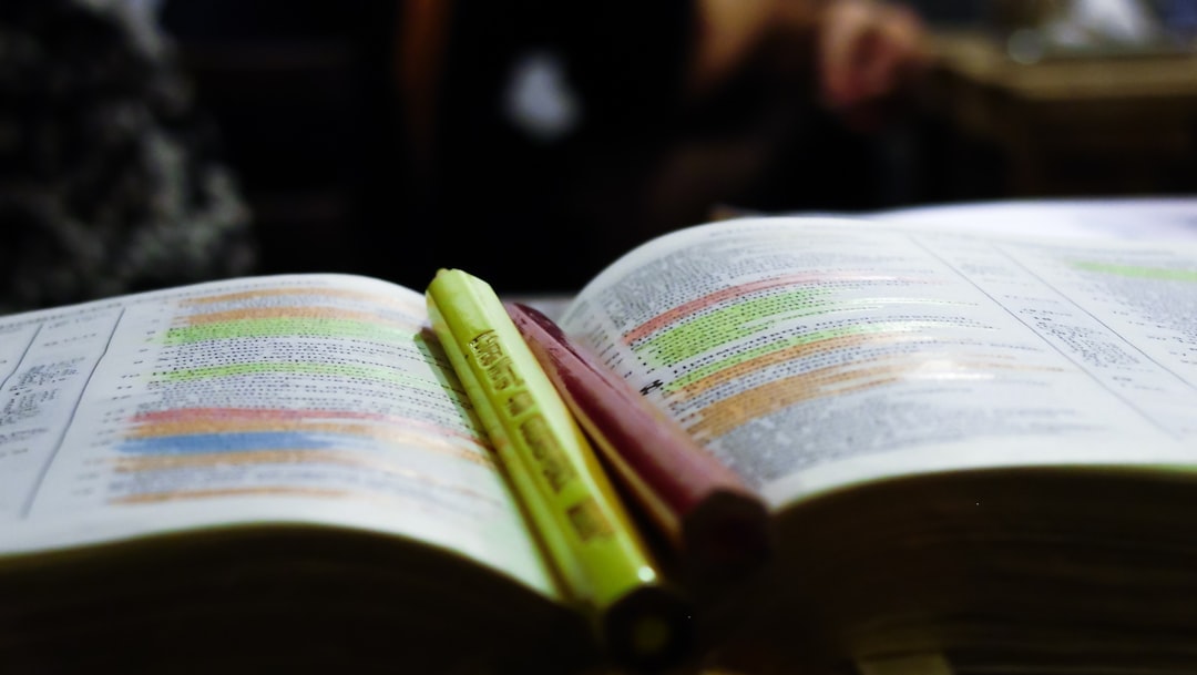 An open book with color highlighters in the middle.