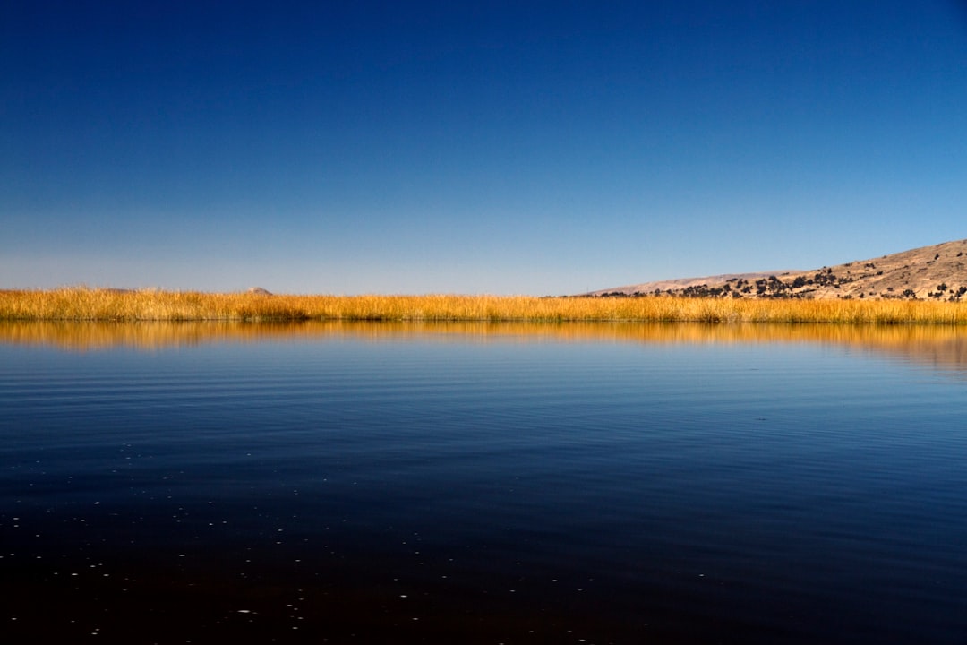 body of water near mountain