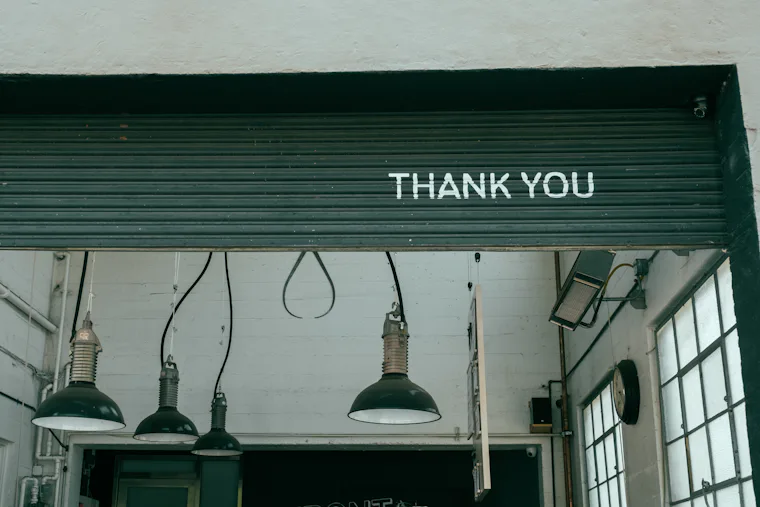 Assorted pendant light fixtures hanging from a ceiling