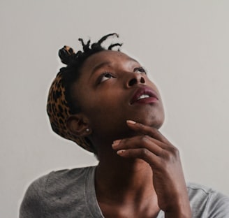 woman in gray top looking upward