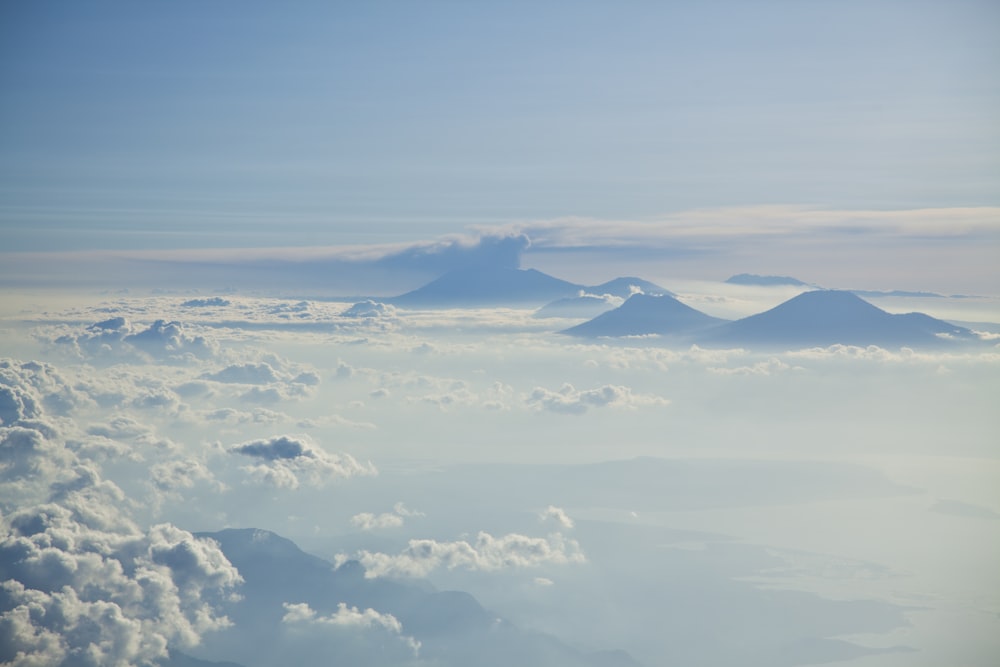 aerial photograph of clouds and mountain