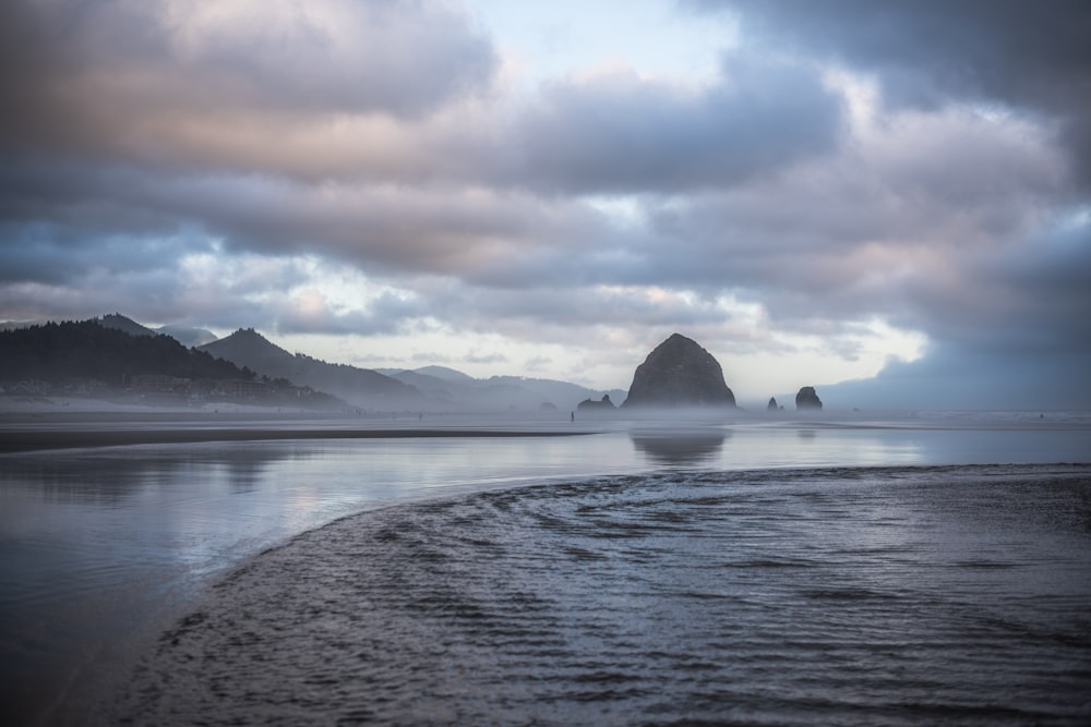 body of water near mountain