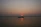 Couple enjoying a serene boat ride through Kerala’s lush backwaters at sunset