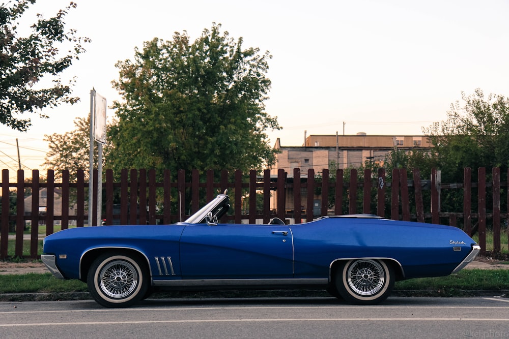 blue convertible coupe on street during daytime