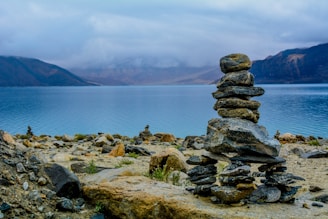 gray rocks stacks on brown surface
