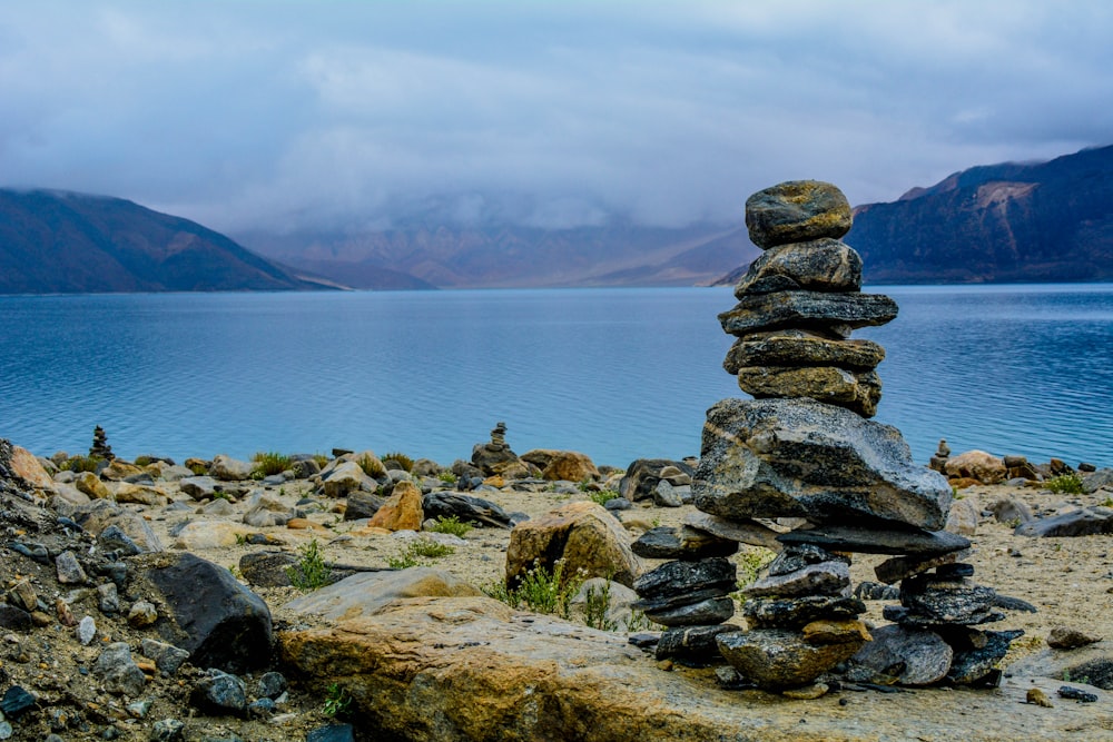 gray rocks stacks on brown surface