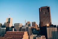City skyline showing modern office buildings at sunset.