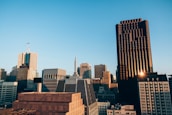 City skyline with office buildings at sunset.
