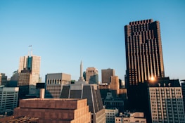 City skyline with office buildings at sunset.