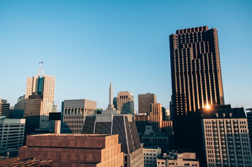 City skyline with office buildings at sunset.