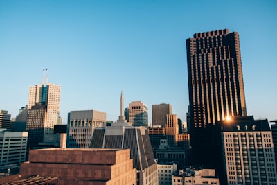 Modern city skyline with high-rise office buildings at sunset