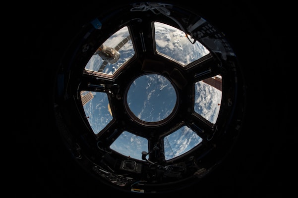 Exoplanet with atmospheric glow and space telescope view