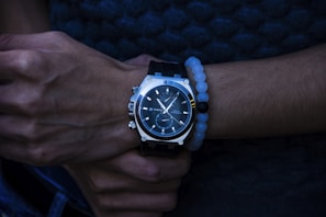 A fashionable wrist adorned with a stylish luxury watch.