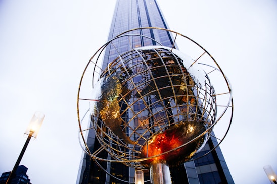 low-angle photography of globe statue