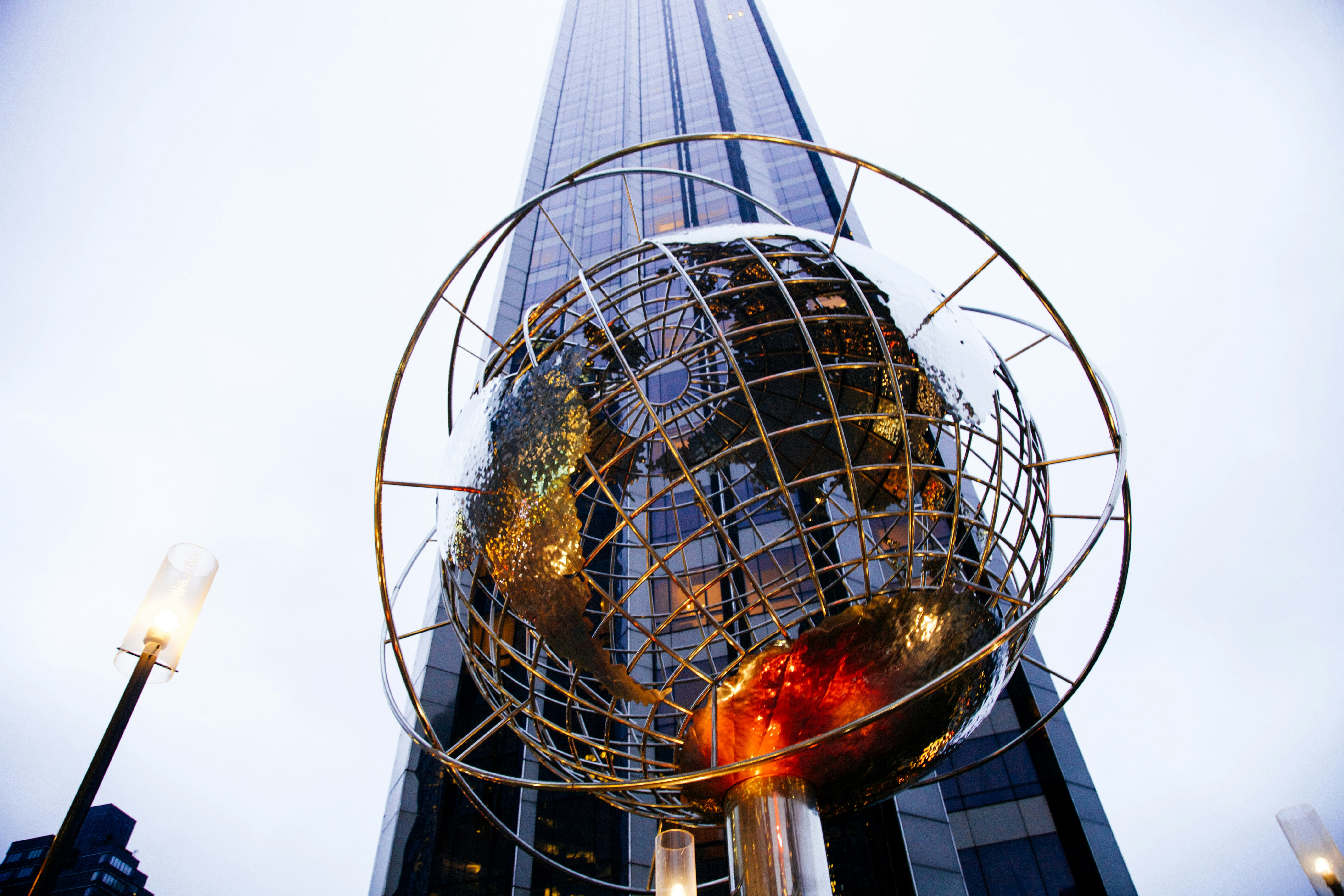 low-angle photography of globe statue