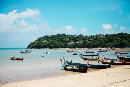 boats on shore during daytime in Ko Samui Thailand