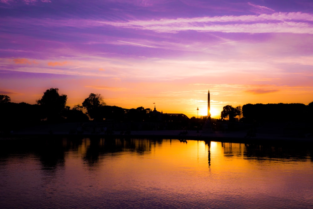 photo of body body of water during golden hour