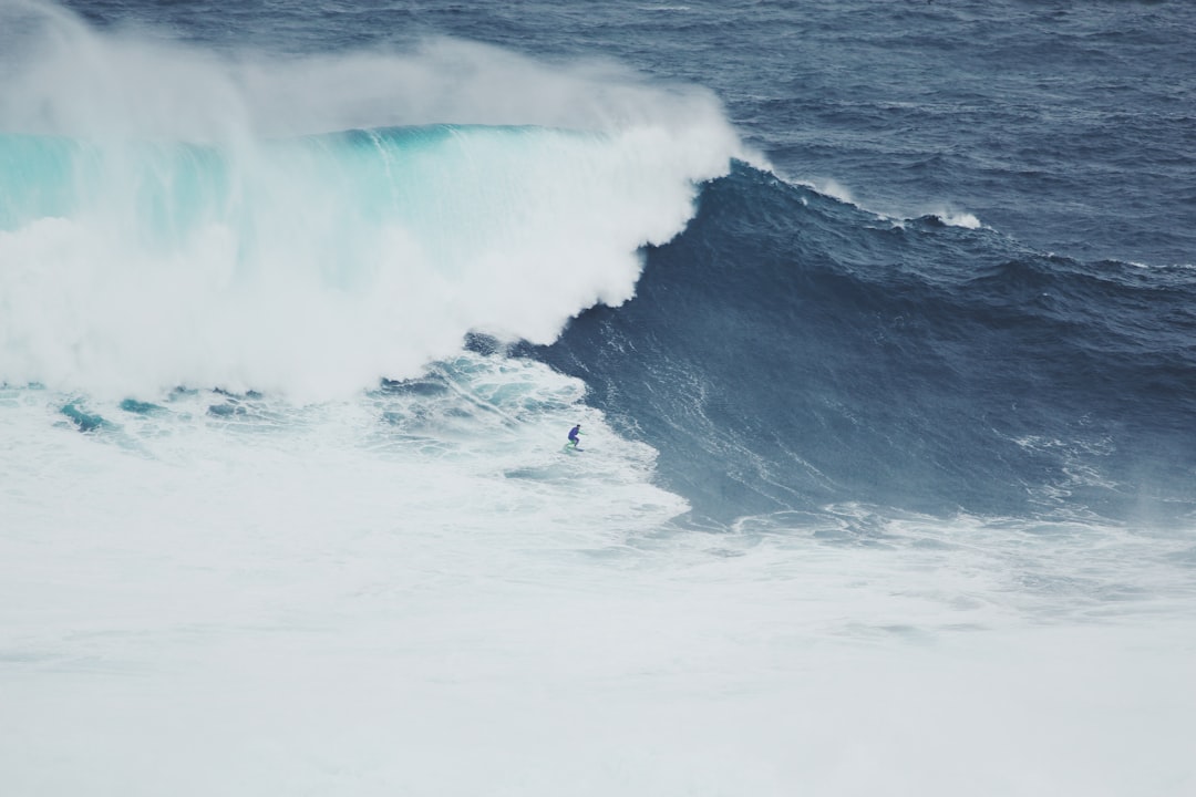 person surfer on seawave at daytime, The crashing waves