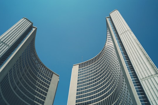 worm's eyeview photo of high rise buildings in Fountain at Nathan Phillips Square Canada