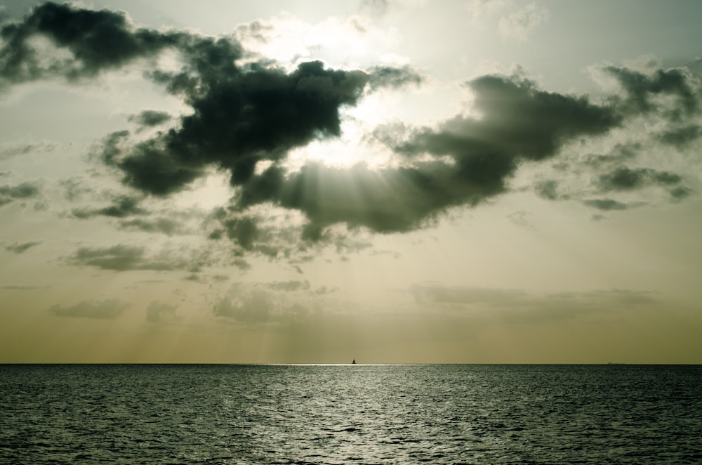 horizontal photography of horizon and sun rays