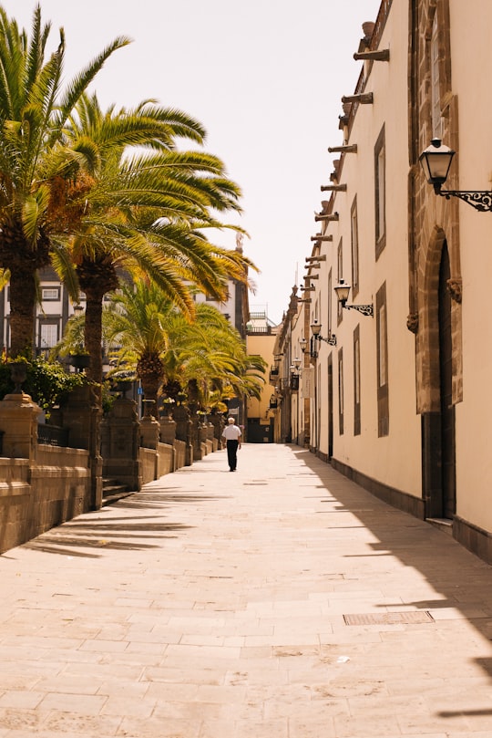 man walking on side walk in Canary Islands Spain