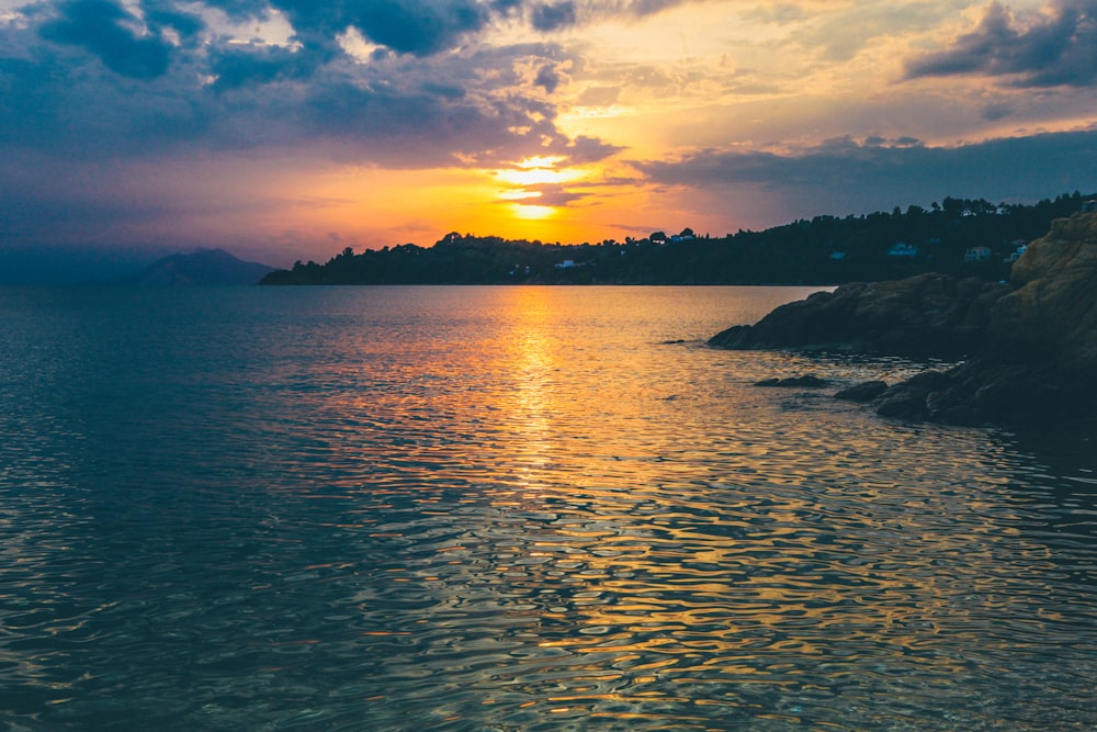 body of water beside shore