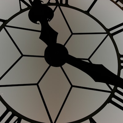 close-up photography of white and black clock
