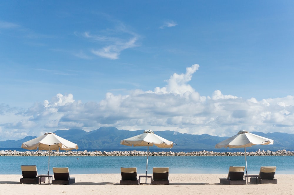 patio umbrella and lounger chair overlooking the sea