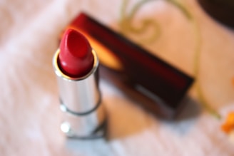 Close-up of a lipstick bullet revealing its rich color.