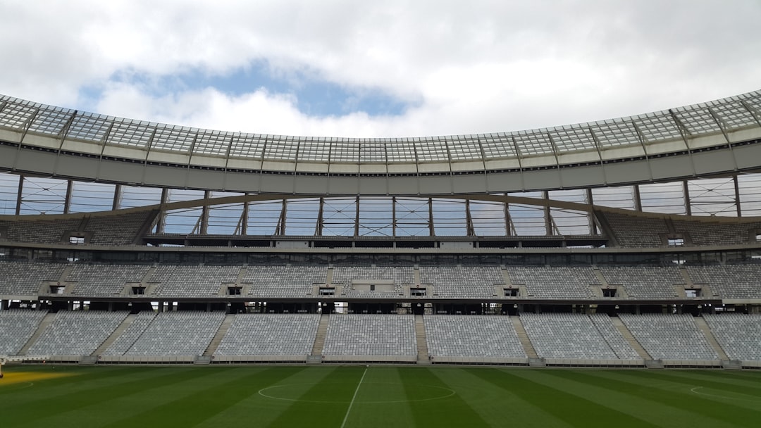football stadium under cloudy sky,