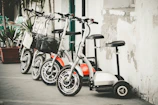 A lineup of oxide max scooters displayed neatly inside the Modinagar showroom.