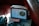 A vintage radio with a central tuning dial rests on a leather seat. Next to it lies a magazine with a partial cover image of a woman's face and the title 'PICTURE POST' in bold red letters, creating a nostalgic ambiance.