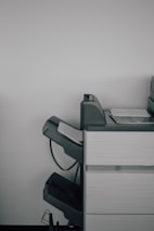 A printer in action producing crisp, clear xerox copies of academic documents.