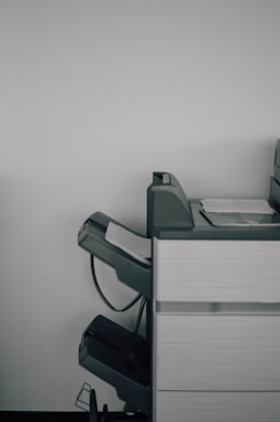 Technician repairing an office printer.