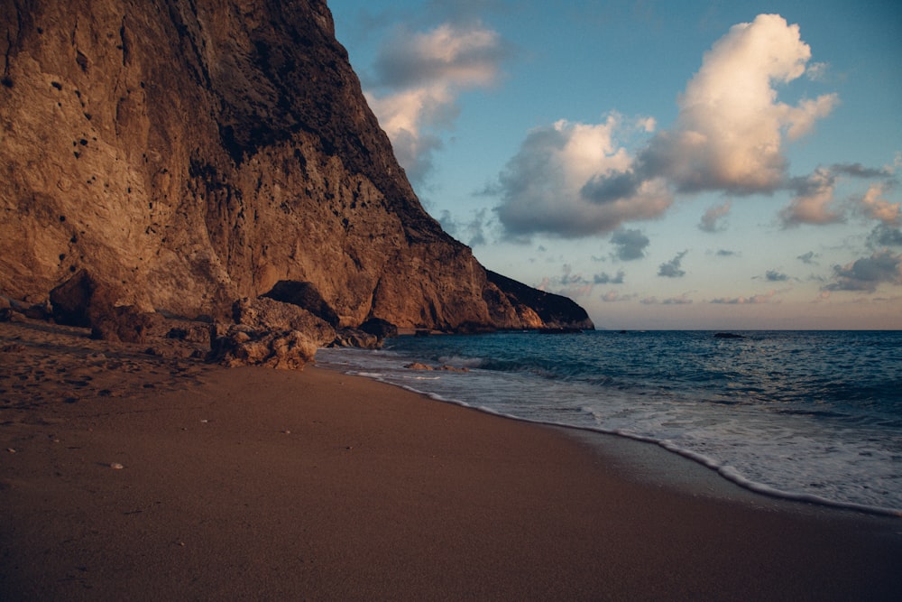 blue ocean water near rock formation