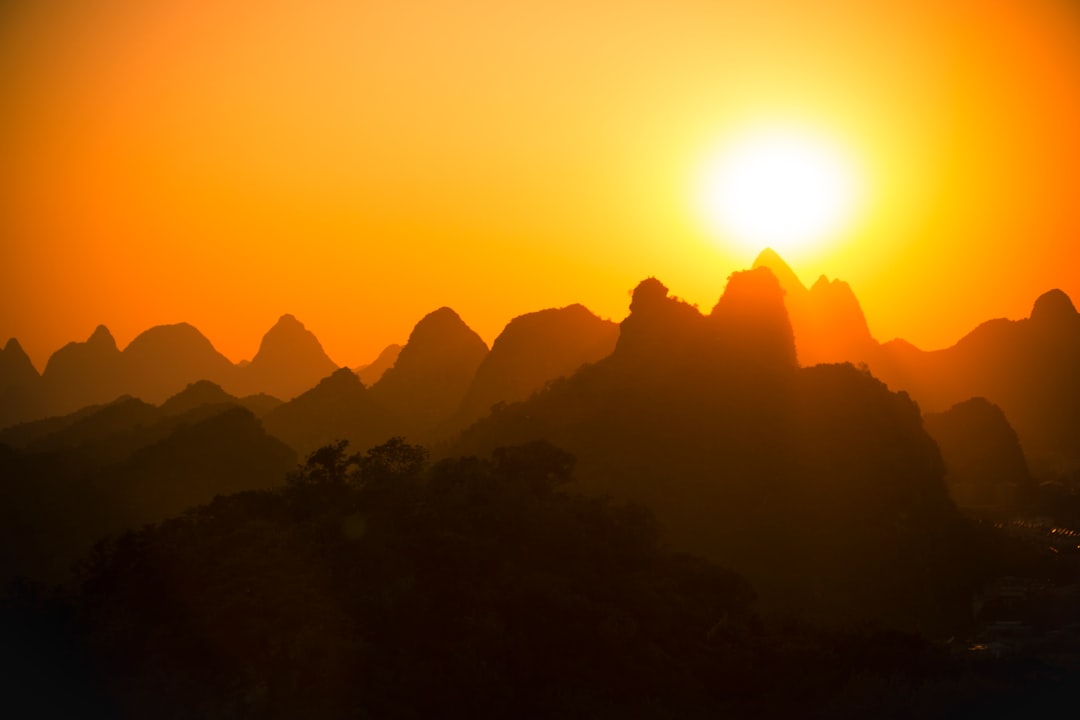 mountain silhouette silhouette during golden hour