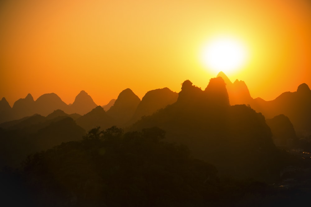 mountain silhouette silhouette during golden hour