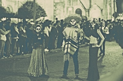 three person standing on street day of the dead zoom background