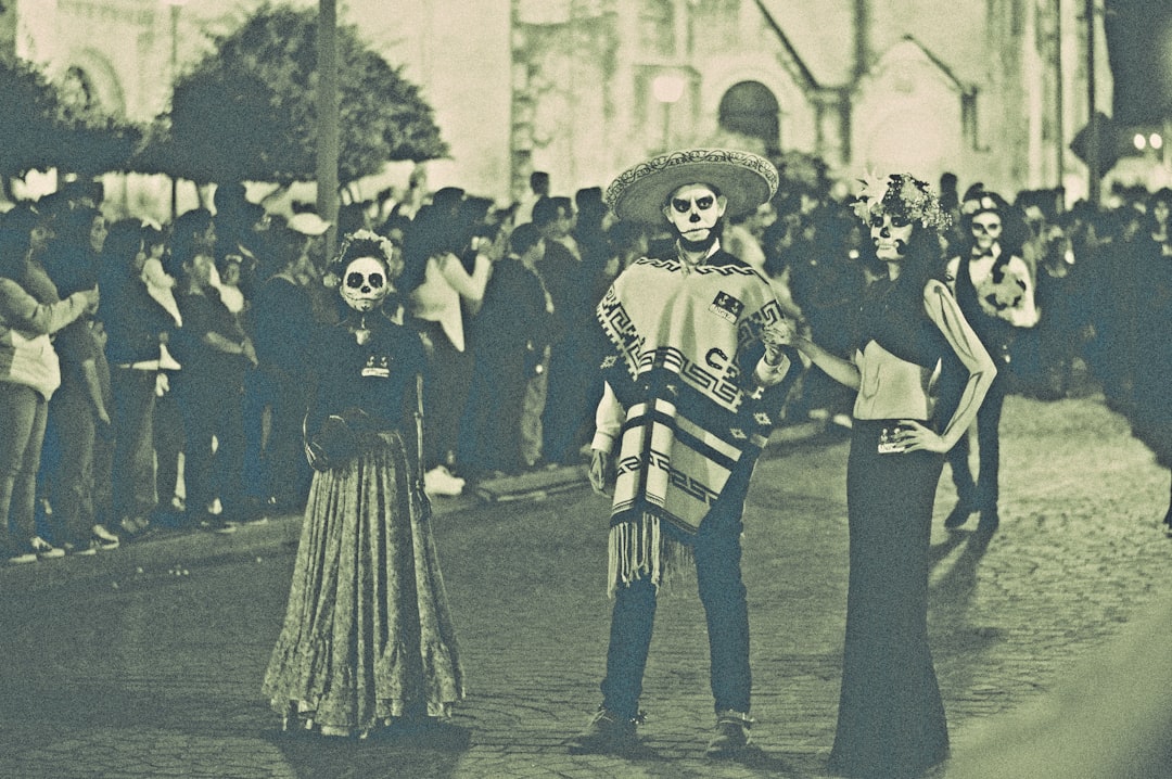 three person standing on street