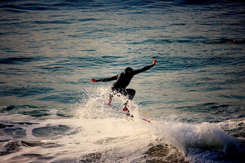 person wakeboarding on the sea