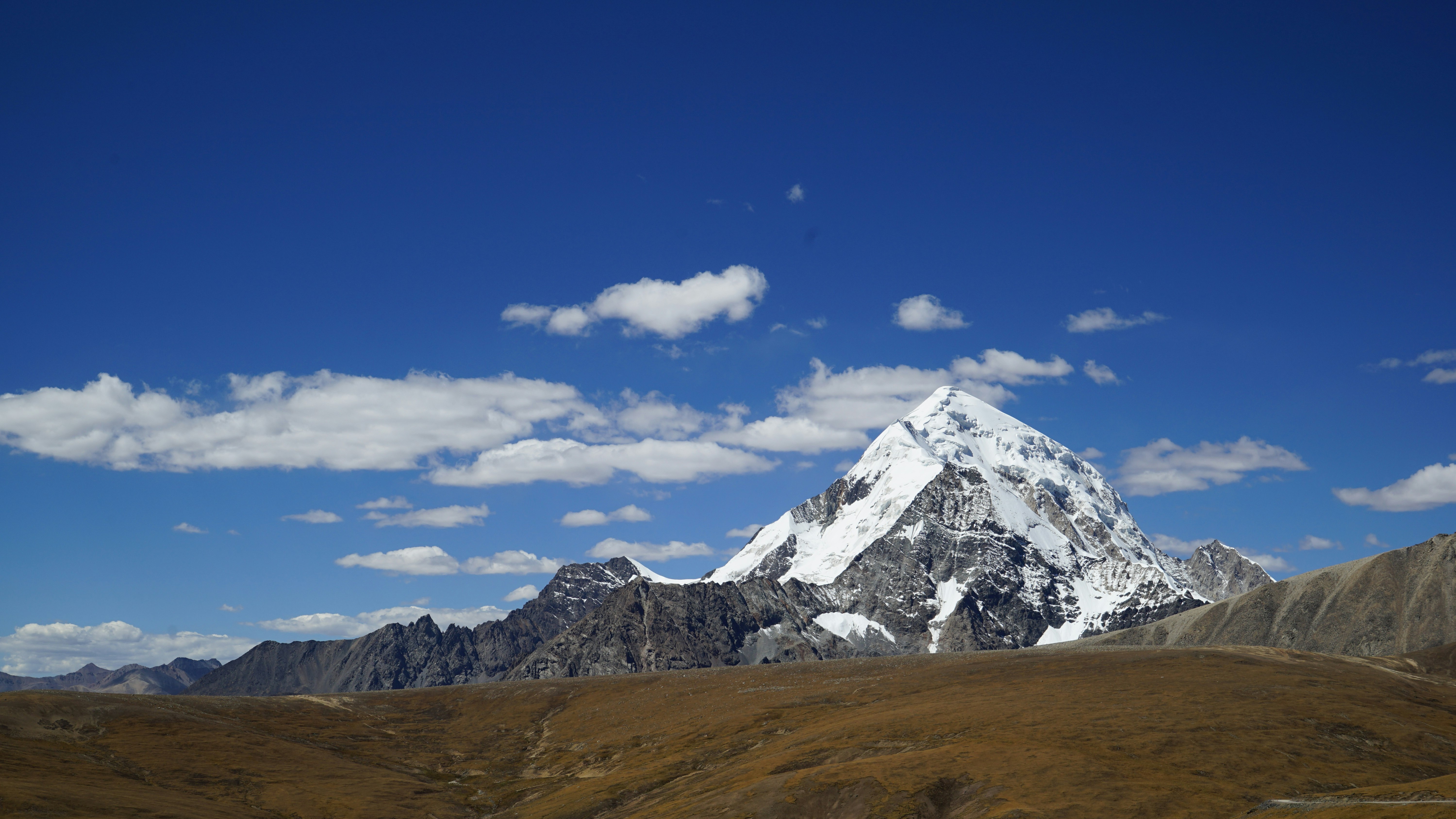 snow covered mountain under clear blue sky