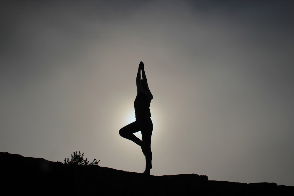 person doing yoga exercises