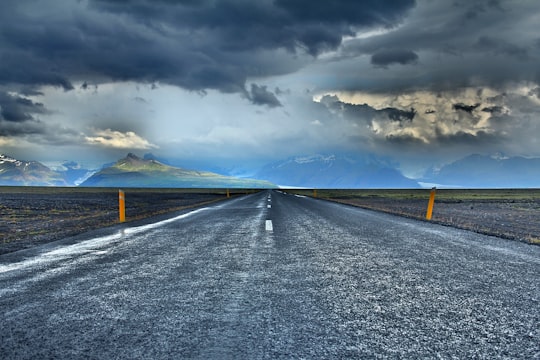 gray road under blue sky during daytime in Kálfafell Iceland