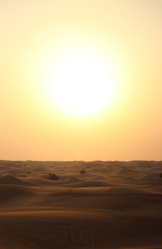 beige sand during sunset
