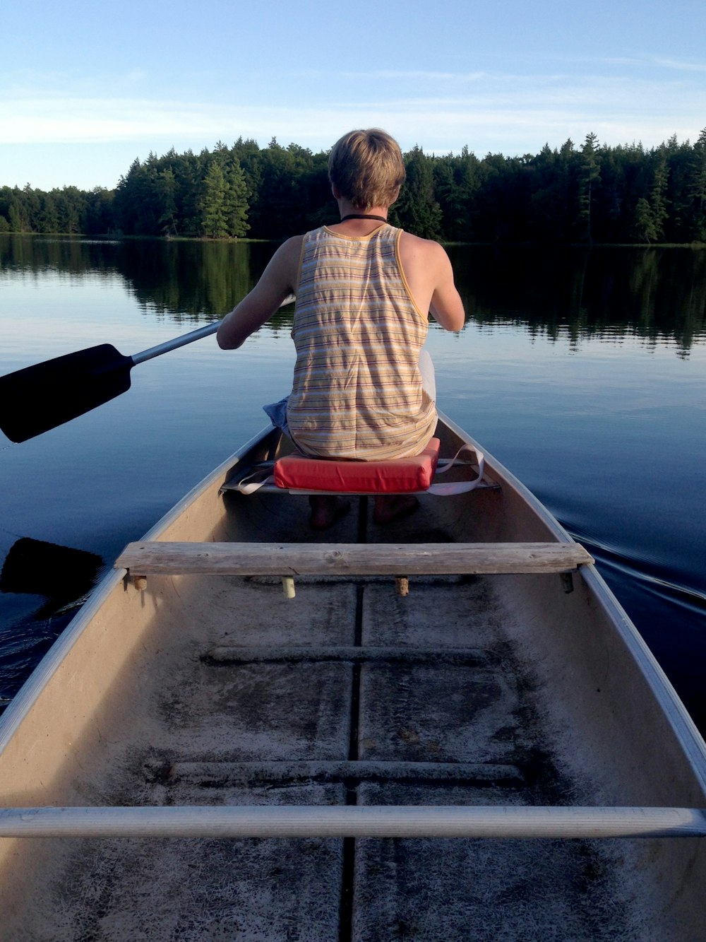 man sitting on boat at daytime