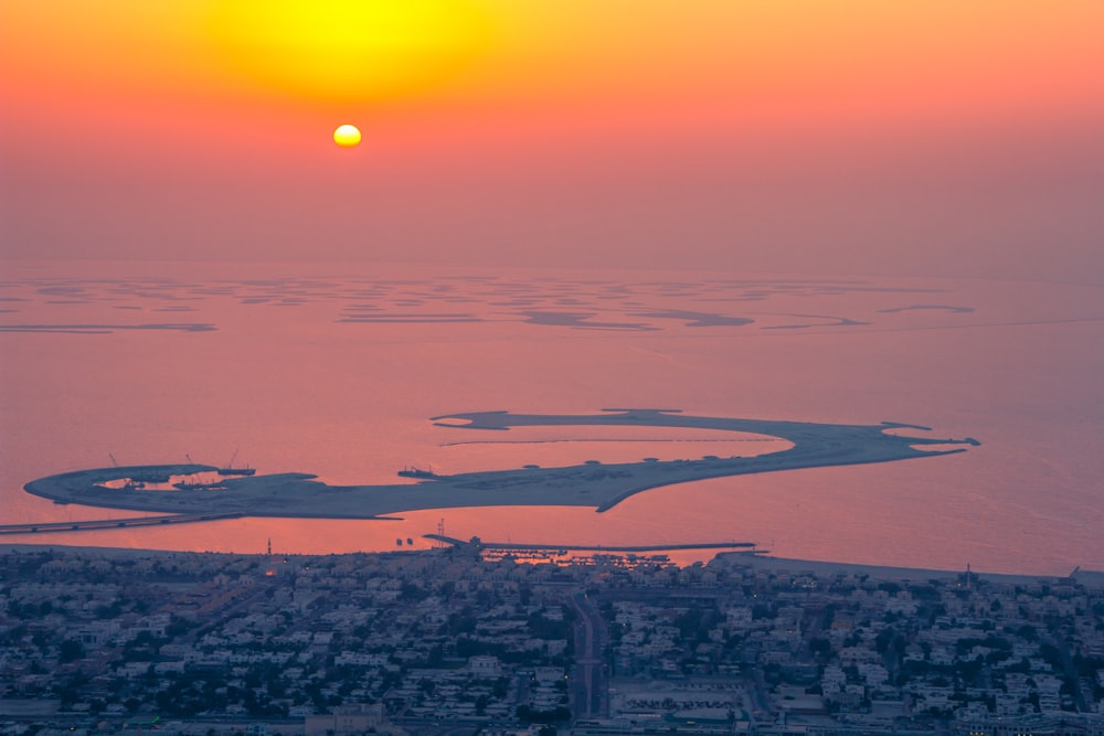 seaside city during sunset