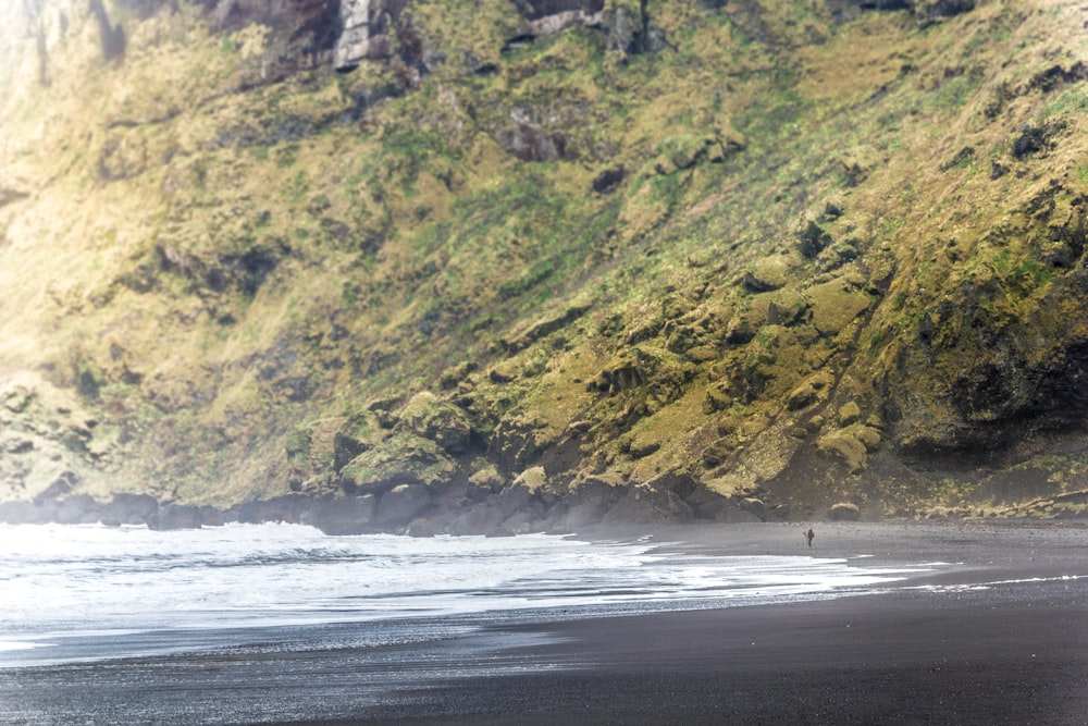 body of water near cliff