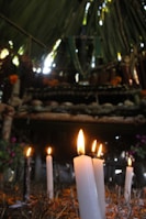 Ceremonial setting with candles and sacred objects arranged for an ayahuasca ritual.